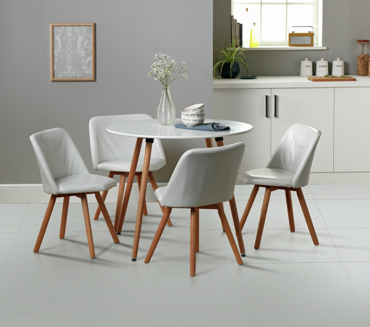 Habitat Quattro Modern Round Dining Table and 4 Chairs in White Faux Leather